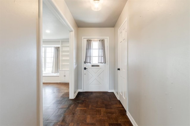 entryway with a wealth of natural light and baseboards