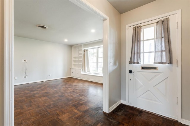 entryway featuring recessed lighting, baseboards, and visible vents