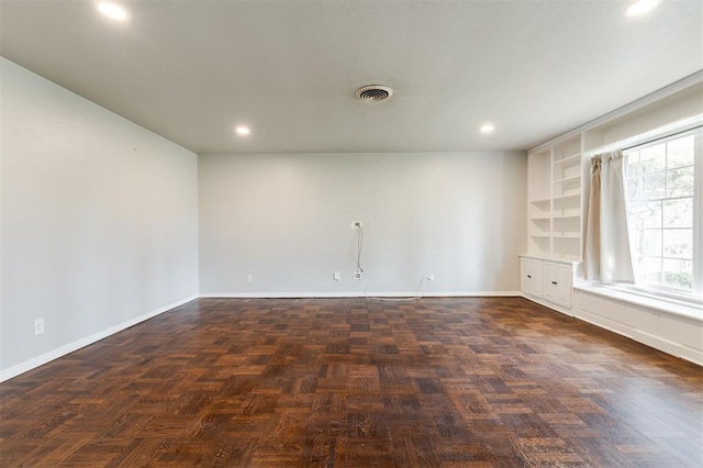 unfurnished room with recessed lighting, baseboards, and visible vents