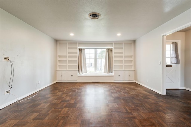 unfurnished room with visible vents, recessed lighting, a textured ceiling, and baseboards