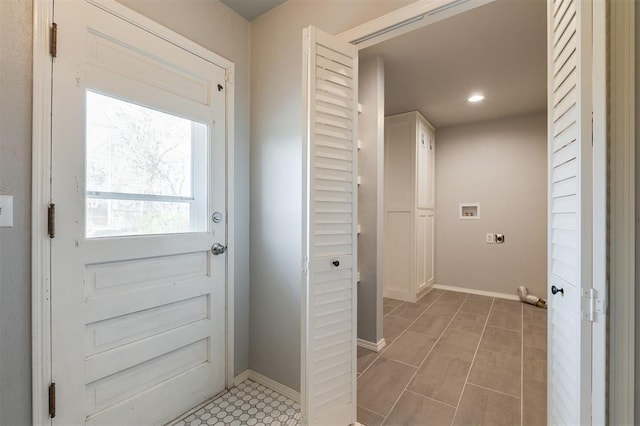 entryway featuring recessed lighting and baseboards