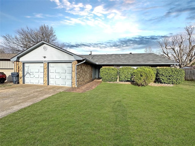 ranch-style house featuring a shingled roof, a front lawn, concrete driveway, a garage, and stone siding