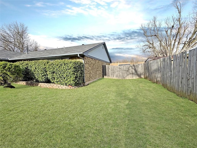 view of yard featuring a fenced backyard