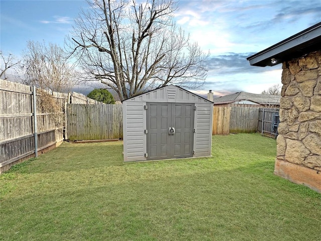 view of shed featuring a fenced backyard