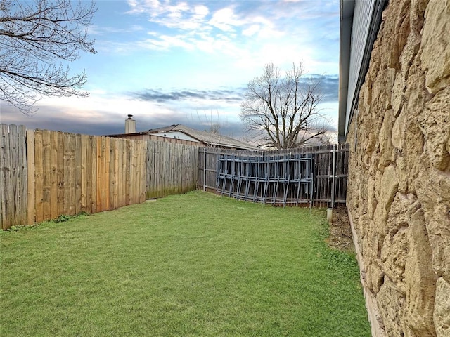 view of yard featuring a fenced backyard