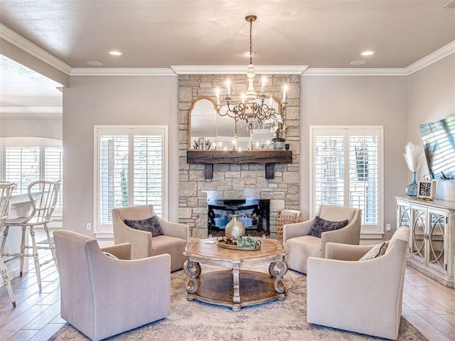 living area featuring a stone fireplace, recessed lighting, wood finished floors, and ornamental molding