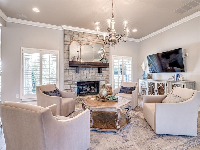 living area featuring visible vents, a stone fireplace, a chandelier, and crown molding