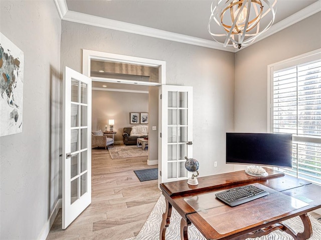 home office featuring a notable chandelier, french doors, crown molding, and light wood-style floors