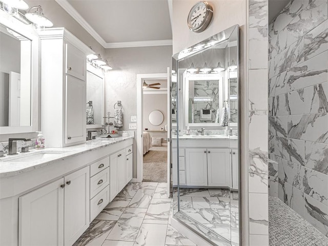 ensuite bathroom with double vanity, a sink, marble finish floor, and ornamental molding