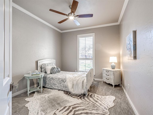 bedroom with a ceiling fan, carpet floors, crown molding, baseboards, and a textured wall