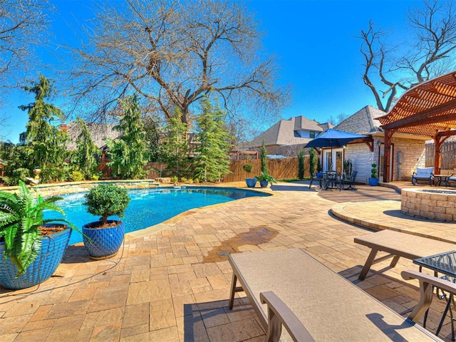 view of swimming pool with a fenced in pool, a patio, a fenced backyard, and a pergola