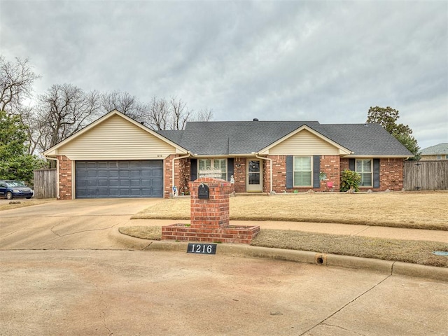 ranch-style home with brick siding, driveway, a garage, and fence