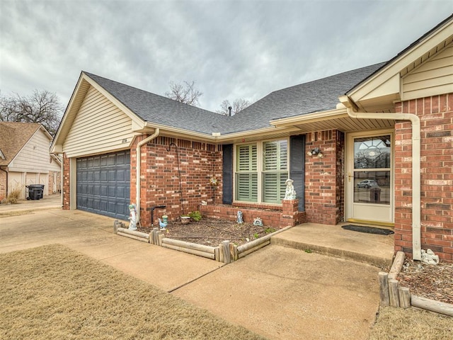 view of front of home with brick siding, a garage, and roof with shingles