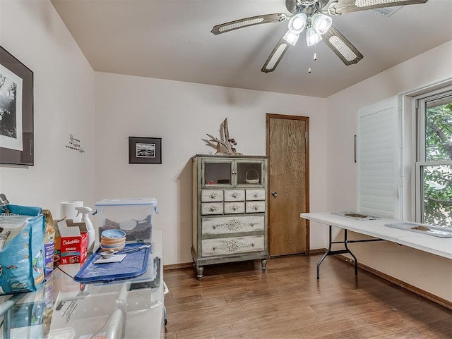 office with wood finished floors, baseboards, and ceiling fan