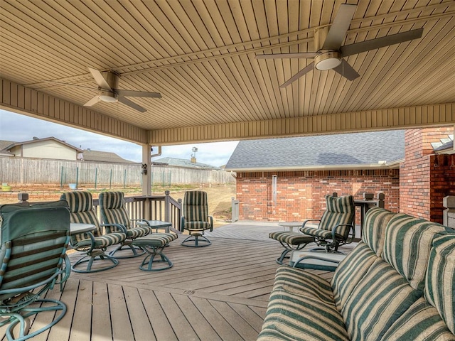 wooden terrace with fence and ceiling fan