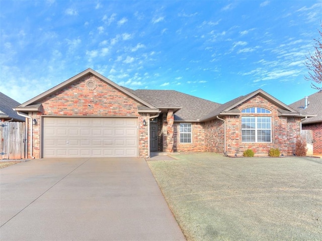 ranch-style house featuring fence, a shingled roof, concrete driveway, a garage, and brick siding