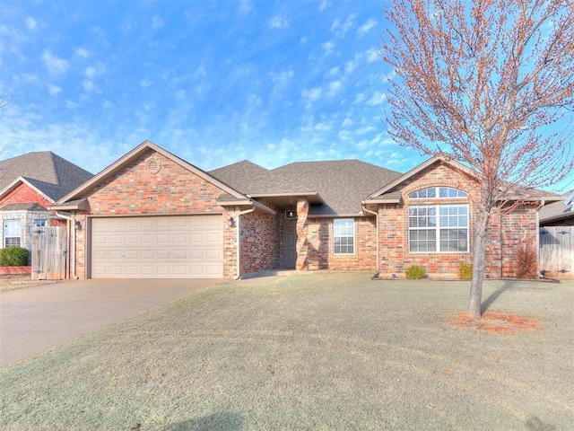 ranch-style house featuring a garage, brick siding, driveway, and a shingled roof