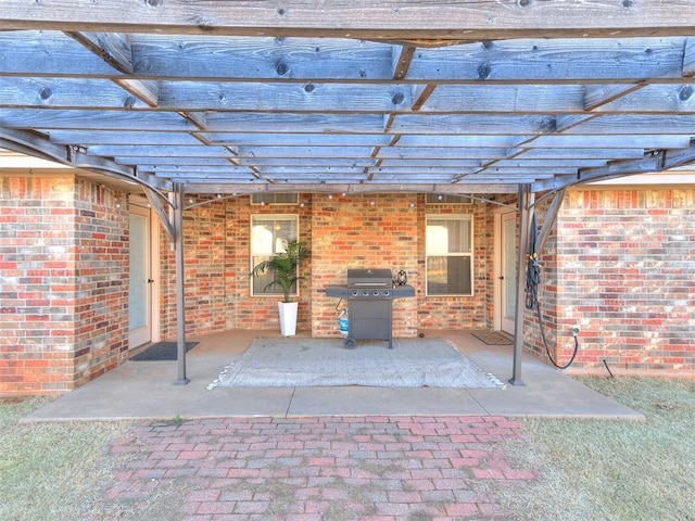 view of patio featuring grilling area and a pergola