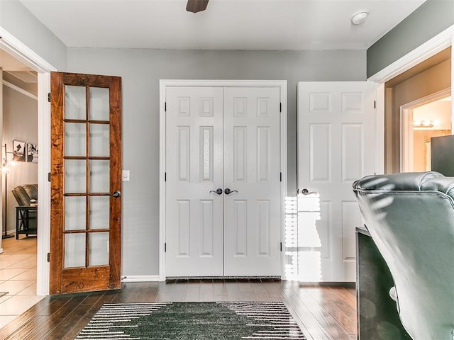 interior space featuring dark wood finished floors and baseboards