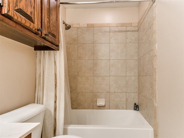 bathroom with toilet and shower / bath combo