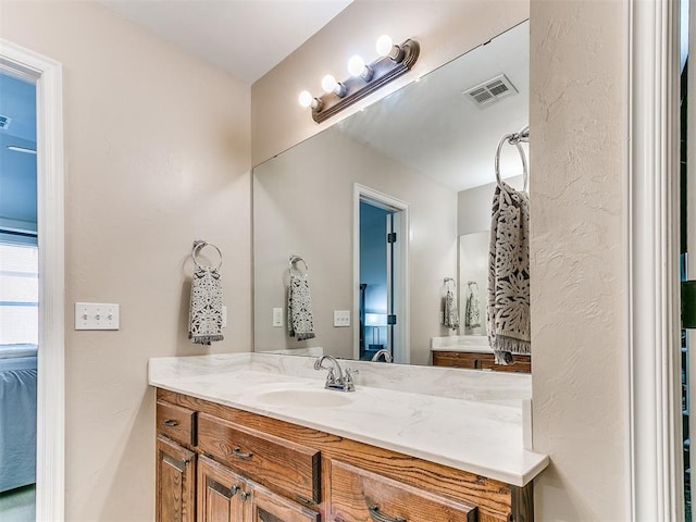 bathroom featuring vanity and visible vents