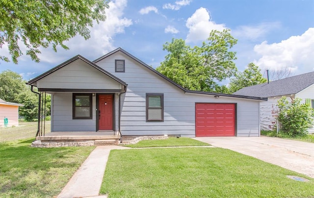 view of front of home with concrete driveway, a garage, and a front lawn