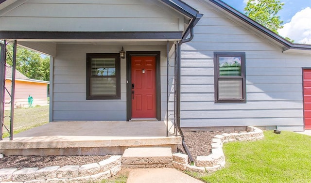 property entrance with covered porch