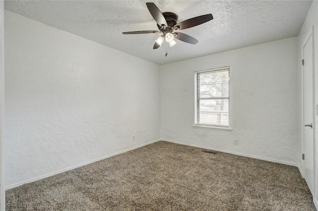 unfurnished room with carpet floors, a textured ceiling, a ceiling fan, and a textured wall