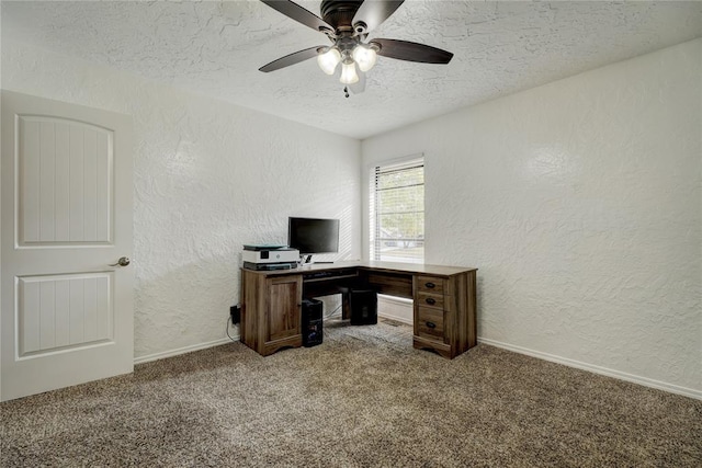 carpeted office with baseboards, a textured ceiling, ceiling fan, and a textured wall