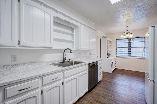 kitchen with dark wood finished floors, stainless steel dishwasher, freestanding refrigerator, an inviting chandelier, and a sink