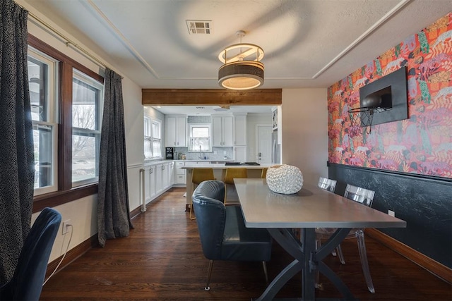 dining area featuring visible vents, baseboards, dark wood-style floors, and wallpapered walls