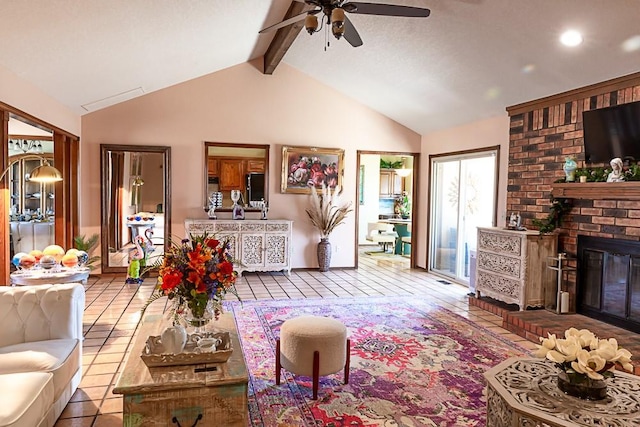 living room with lofted ceiling with beams, a brick fireplace, a ceiling fan, and tile patterned floors