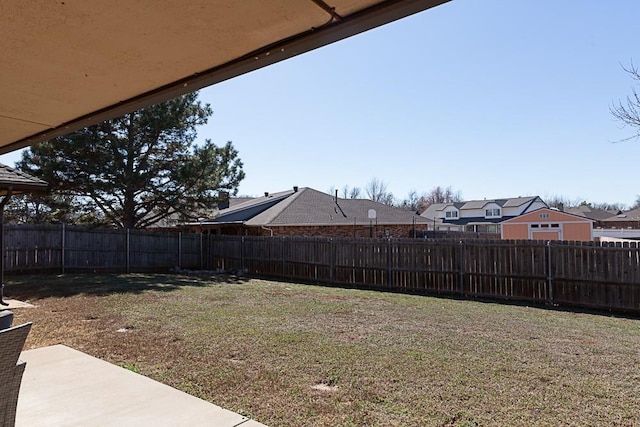 view of yard with a fenced backyard