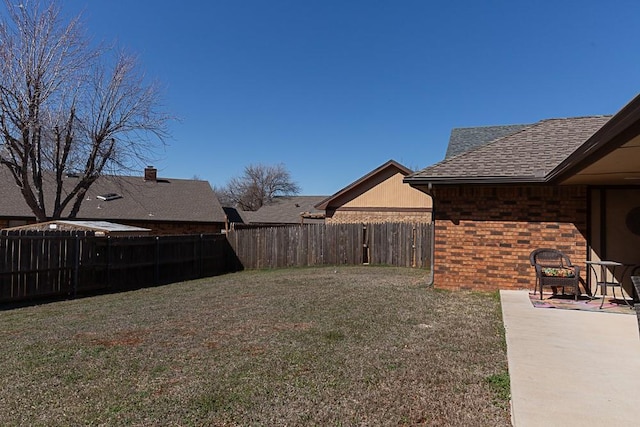 view of yard featuring a patio and a fenced backyard