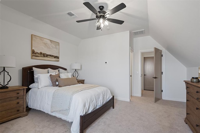 bedroom with visible vents, lofted ceiling, light colored carpet, and baseboards