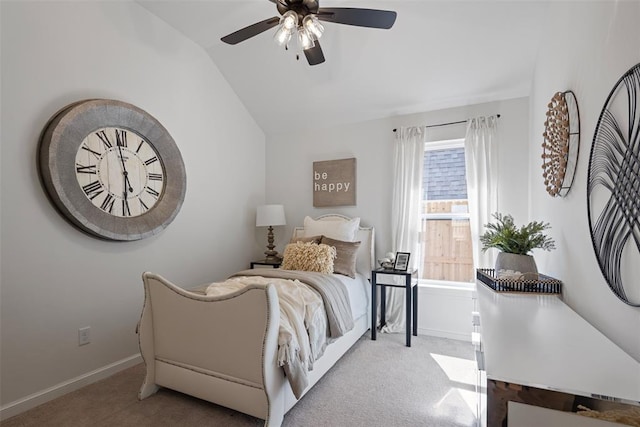 carpeted bedroom featuring baseboards, a ceiling fan, and vaulted ceiling