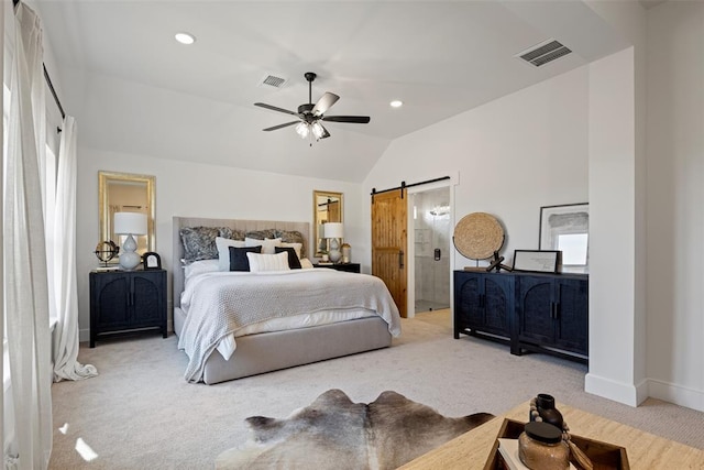 carpeted bedroom with visible vents, baseboards, a barn door, and vaulted ceiling