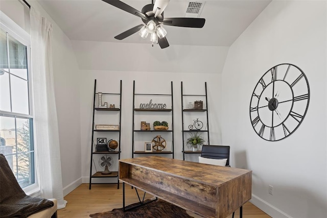 office area with a ceiling fan, light wood-style floors, visible vents, and baseboards