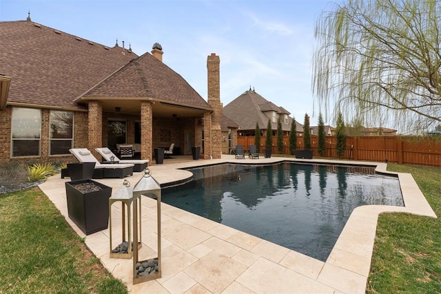 view of pool featuring a fenced in pool, an outdoor living space with a fire pit, fence private yard, a yard, and a patio