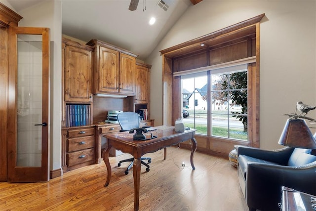 office area featuring visible vents, baseboards, ceiling fan, vaulted ceiling, and light wood-style flooring