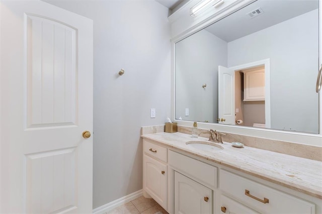 bathroom with tile patterned flooring, visible vents, vanity, and baseboards