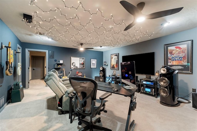 interior space with a ceiling fan and carpet