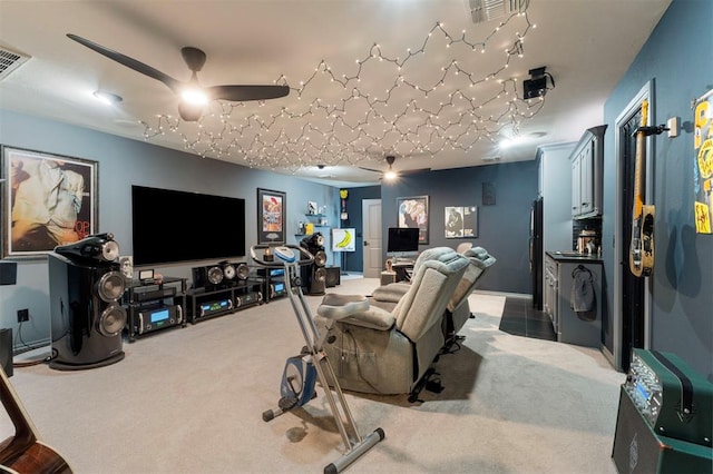 cinema featuring carpet flooring, ceiling fan, and visible vents