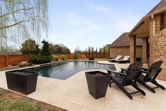 view of pool with a patio area, a fenced in pool, and a fenced backyard