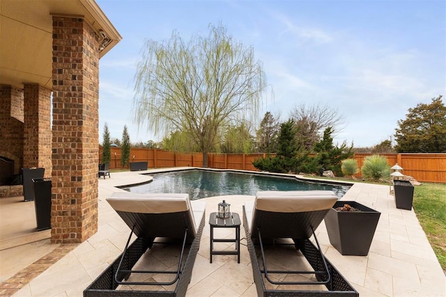 view of pool with a fenced in pool, a fenced backyard, and a patio area