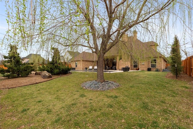 view of yard featuring a patio and fence