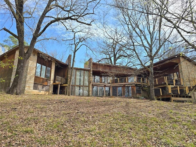 rear view of property featuring crawl space