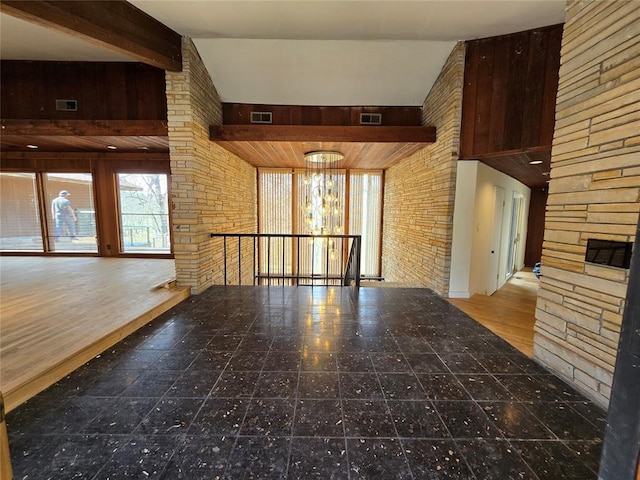 interior space featuring beam ceiling and visible vents