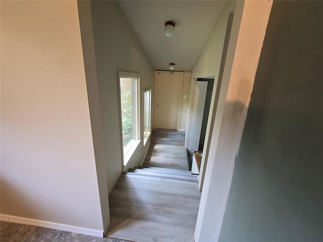 801 NE Ave C, Idabel, OK 74745 - hallway featuring vaulted ceiling and wood finished floors