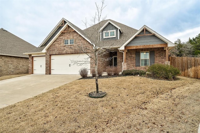 craftsman inspired home with brick siding, concrete driveway, roof with shingles, and fence